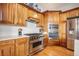 Spacious kitchen with stainless steel appliances and custom cabinetry at 1236 Castlecombe Ln, Monument, CO 80132