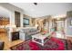 Comfortable living room showcasing open floor plan, stylish decor, and easy access to other living spaces at 1236 Castlecombe Ln, Monument, CO 80132