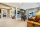 Cozy living room with stone fireplace, TV, and easy access to the basement bedroom at 1236 Castlecombe Ln, Monument, CO 80132