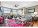 Spacious living area featuring large windows, comfortable seating, and an inviting atmosphere at 1236 Castlecombe Ln, Monument, CO 80132