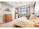 Bright main bedroom with bay windows offering a golf course view and ample space at 1236 Castlecombe Ln, Monument, CO 80132