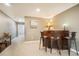 Basement wet bar with room for seating and plenty of space to entertain guests at 1236 Castlecombe Ln, Monument, CO 80132