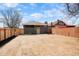 Large backyard featuring a newly stained fence, yard, and an updated back door at 3600 N Race St, Denver, CO 80205
