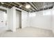 Basement bedroom with carpeted floors, neutral paint, windows, closet and modern lighting fixture at 3600 N Race St, Denver, CO 80205