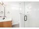Bright, stylish bathroom featuring an open glass shower, floating vanity, and modern fixtures at 3600 N Race St, Denver, CO 80205