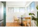 Cozy breakfast nook features modern table setting with natural light from multiple windows at 3600 N Race St, Denver, CO 80205