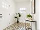 Stylish foyer with patterned tile flooring and a modern console table at 3600 N Race St, Denver, CO 80205