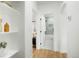 Hallway with open shelving leads to stylish bathroom and bedroom spaces at 3600 N Race St, Denver, CO 80205