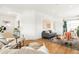 Inviting living area featuring hardwood floors, stylish furniture, and an open layout at 3600 N Race St, Denver, CO 80205