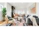 Modern living room featuring stylish decor, hardwood floors, and plenty of natural light at 3600 N Race St, Denver, CO 80205