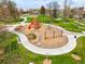 Aerial view of neighborhood playground with swingset, play equipment, and benches at 3600 N Race St, Denver, CO 80205