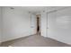 Carpeted bedroom with neutral walls, closet, and contemporary door design at 1415 Great Western Dr, Longmont, CO 80501