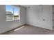 Well-lit bedroom with plush carpeting and large window offering a scenic view at 1415 Great Western Dr, Longmont, CO 80501