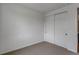 Simple room showcases closet space and neutral carpeting at 1415 Great Western Dr, Longmont, CO 80501