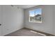 Cozy room with neutral carpet and a view of the neighboring homes at 1415 Great Western Dr, Longmont, CO 80501