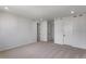 Neutral bedroom with carpet, white walls, and three doors enhancing the space at 1415 Great Western Dr, Longmont, CO 80501
