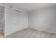 Comfortable bedroom with neutral carpet and closet with sliding doors at 1415 Great Western Dr, Longmont, CO 80501