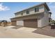 Exterior shows a two-story home with a two-car garage and light-colored siding at 1415 Great Western Dr, Longmont, CO 80501