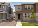 Inviting two-story home with a mix of stone and siding, complemented by a neat walkway and fresh landscaping at 1415 Great Western Dr, Longmont, CO 80501