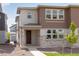 Charming two-story home featuring stone accents and a well-manicured front yard for great curb appeal at 1415 Great Western Dr, Longmont, CO 80501
