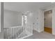 Hallway on second level, featuring neutral carpet, white trim, and natural light at 1415 Great Western Dr, Longmont, CO 80501