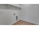 Bright laundry room features durable wood-look flooring and convenient shelving at 1415 Great Western Dr, Longmont, CO 80501