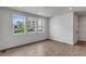 Spacious living area with light wood floors, recessed lights and large windows flooding the room with natural light at 1415 Great Western Dr, Longmont, CO 80501