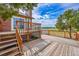 Multi-level deck area offering outdoor relaxation with views of the surrounding landscape at 35675 Cheyenne Trl, Elizabeth, CO 80107