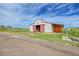 Exterior view of barn with red accents on a beautiful lot at 35675 Cheyenne Trl, Elizabeth, CO 80107