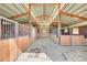 Functional barn interior with multiple horse stalls, creating a comfortable environment at 35675 Cheyenne Trl, Elizabeth, CO 80107