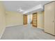 Spacious basement featuring french doors, carpeted floors, and ample space for various activities at 35675 Cheyenne Trl, Elizabeth, CO 80107
