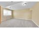 Finished basement with neutral carpet, bright lighting, and ample space for recreation or storage at 35675 Cheyenne Trl, Elizabeth, CO 80107