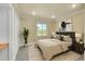 Bright bedroom featuring a large window with scenic views and neutral decor at 35675 Cheyenne Trl, Elizabeth, CO 80107