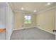 Empty carpeted bedroom with window view, offers a calming atmosphere and closet space at 35675 Cheyenne Trl, Elizabeth, CO 80107
