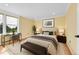 Well-lit bedroom features a window view and desk with chair at 35675 Cheyenne Trl, Elizabeth, CO 80107