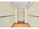 Walk-in closet features shelving and rods for optimal organization and storage space at 35675 Cheyenne Trl, Elizabeth, CO 80107