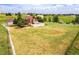 Charming home with a large grassy yard, white fence, and a shed at 35675 Cheyenne Trl, Elizabeth, CO 80107