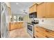 Bright kitchen features stainless steel appliances, granite countertops, and an adjacent dining area at 35675 Cheyenne Trl, Elizabeth, CO 80107
