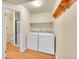 Functional laundry room with side by side washer and dryer units and ample space at 35675 Cheyenne Trl, Elizabeth, CO 80107