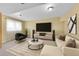 Cozy living room with plush seating, large TV, and stylish decor at 35675 Cheyenne Trl, Elizabeth, CO 80107