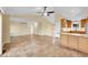 Open floor plan with fireplace, hardwood floors and bar top at 35675 Cheyenne Trl, Elizabeth, CO 80107