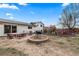 This spacious backyard includes a fire pit, seating, and playground at 217 Douglas Fir Ave, Castle Rock, CO 80104