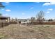 Spacious backyard featuring a fire pit and playset, perfect for outdoor fun at 217 Douglas Fir Ave, Castle Rock, CO 80104