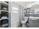 The remodeled bathroom features a tub, new vanity and storage shelves at 217 Douglas Fir Ave, Castle Rock, CO 80104