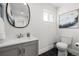 Clean half bathroom with modern fixtures and a sleek design at 217 Douglas Fir Ave, Castle Rock, CO 80104