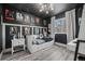 Whimsical bedroom with a Star Wars theme, featuring a daybed and sleek black walls at 217 Douglas Fir Ave, Castle Rock, CO 80104