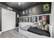 This bedroom features a daybed, Star Wars decor, modern ceiling light, and gray wood flooring at 217 Douglas Fir Ave, Castle Rock, CO 80104