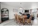 Inviting dining room featuring a wooden table with seating for six and stylish decor at 217 Douglas Fir Ave, Castle Rock, CO 80104