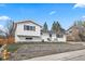 Well-maintained home with a landscaped front yard and neutral siding at 217 Douglas Fir Ave, Castle Rock, CO 80104