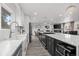 Modern kitchen with stainless steel appliances, lots of counter space and seamlessly transitions into the living area at 217 Douglas Fir Ave, Castle Rock, CO 80104